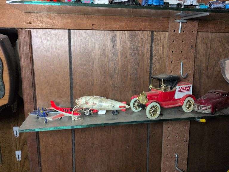 Cast iron blimp, Ertl replica 1918 Ford Model T bank, Schuco #175 car, 2 toy planes image