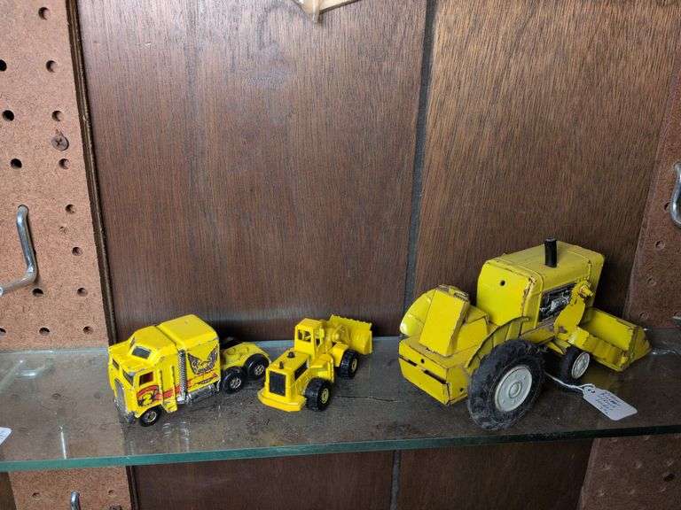 7" Yellow tractor with front loader, 3.5" yellow tractor with front loader and Hot Wheels Thunder Roller image