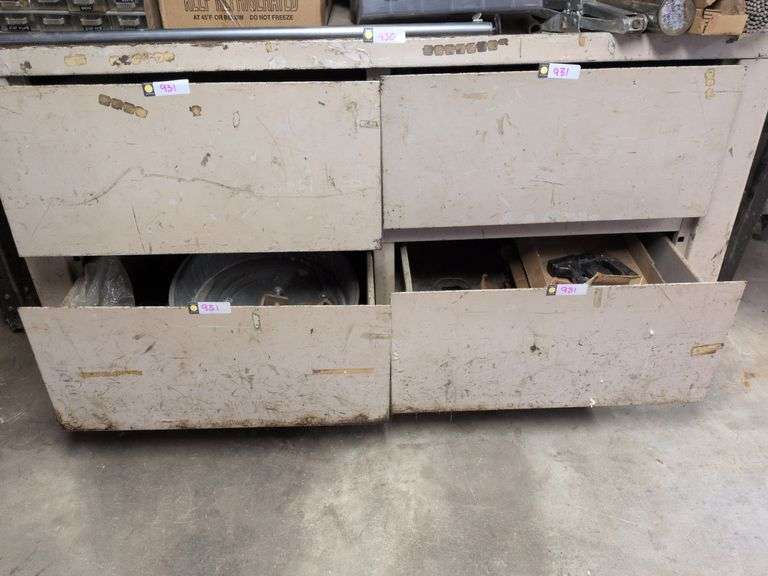 4 drawers: concrete and sheetrock tools, staple gun, staples, oil pan and misc. image