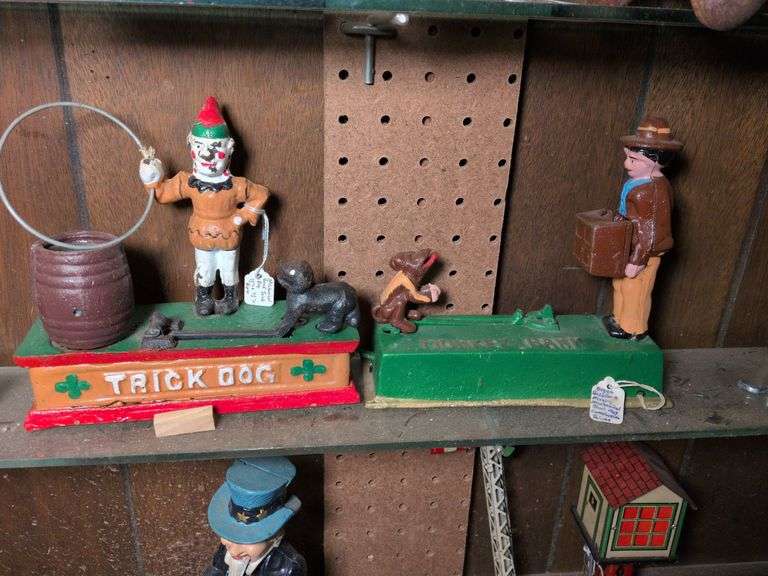 Mechanical trick dog cast iron bank and mechanical cast iron dog bank image