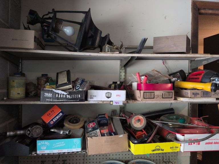 3 shelves: outdoor lamp, weed eater line, impact wrench, spark plugs, distributor cap and misc. image