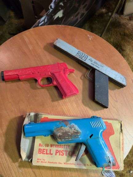 Wyandotte #41 water pistol, Bozo fly shooter, Wyandotte bell pistol with box, Ohio Art toy gun image