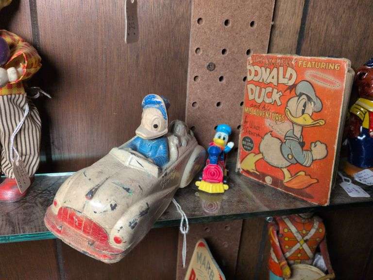 Sun Rubber Donald Duck & Pluto Roadster, Silly Symphony book featuring Donald Duck, Donald in a train and mini Donald on a trapeze bar image