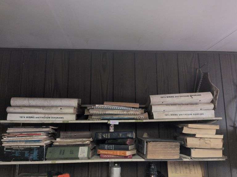 3 shelves: Auto manuals, wiring and vacuum diagrams and misc. image