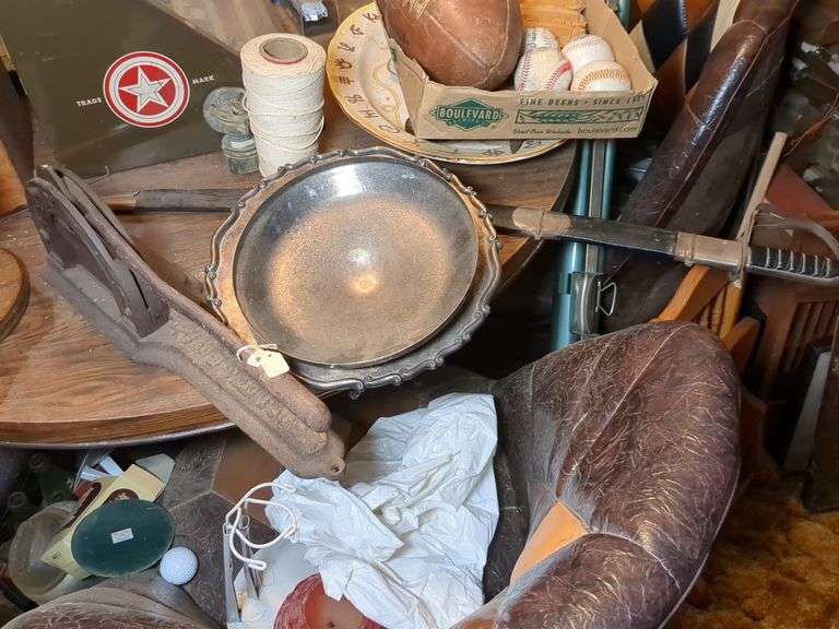 Antique cast iron tobacco cutter, sword, and silver serving dish image