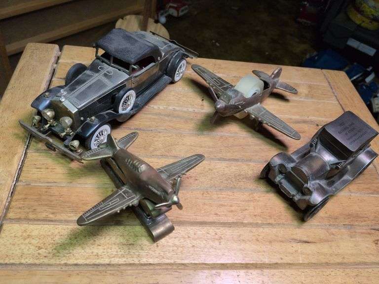 Metal plane stapler, metal plane tape dispenser battery operated radio car and metal car bank image