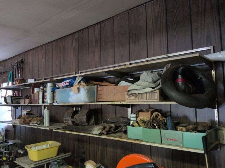4 shelves: nails, saws, squirrel cage blower, air brush gun and misc. image