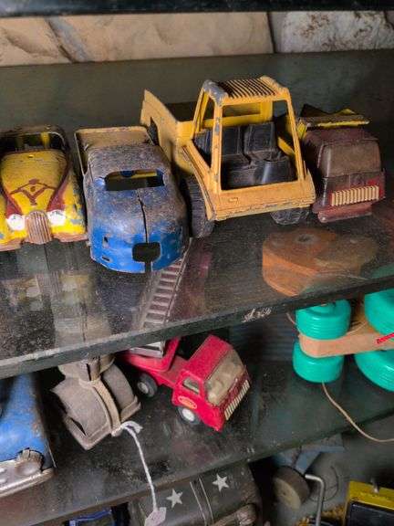 Hubley sports car, Tonka dump truck, and 2 misc dump trucks image