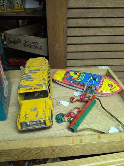 Hubley school bus, J Chein boat, and Chinese made Pecking chickens toy image
