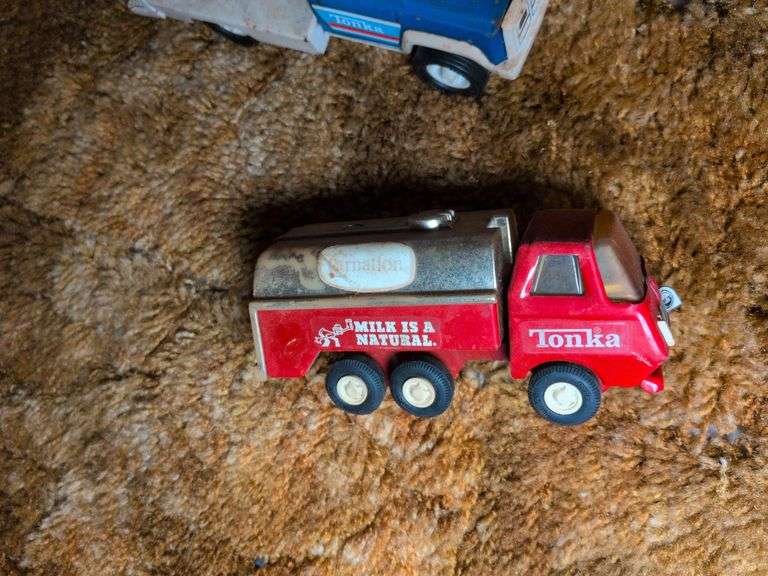 Structo trailer, Marx truck, Hubley Road Roller, and 3 Tonka trucks image