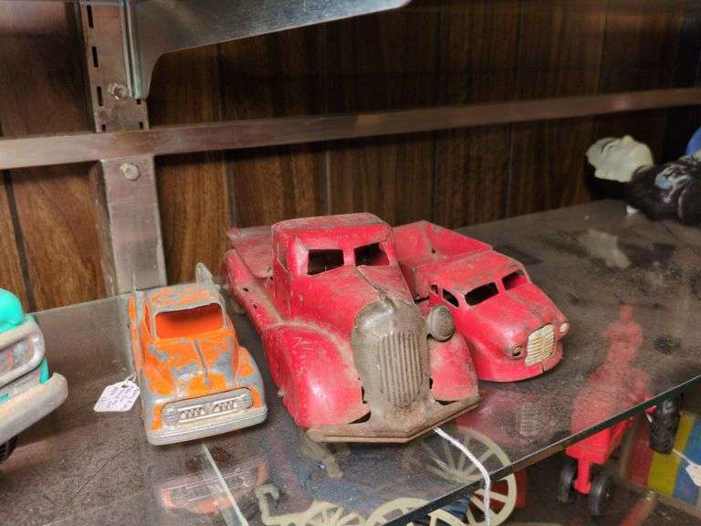 Hubley #452 tow truck, Marx Searchlight truck, and Wyandotte dump truck image