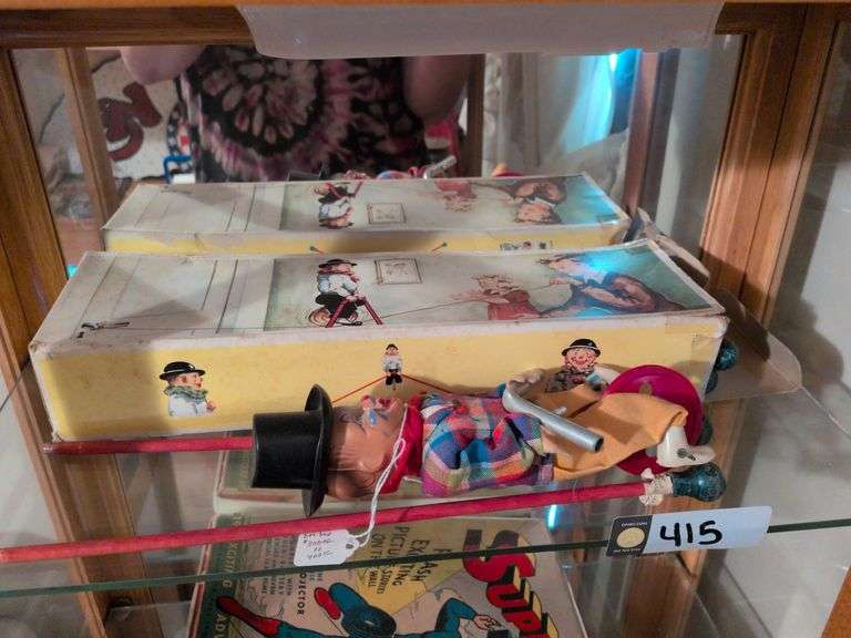 2 Fewo Clowns on high wire with one box image