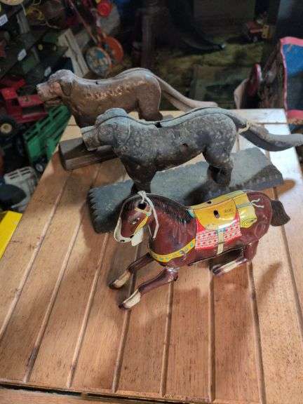 Tin litho wind-up horse and 2 cast iron dog nutcrackers image