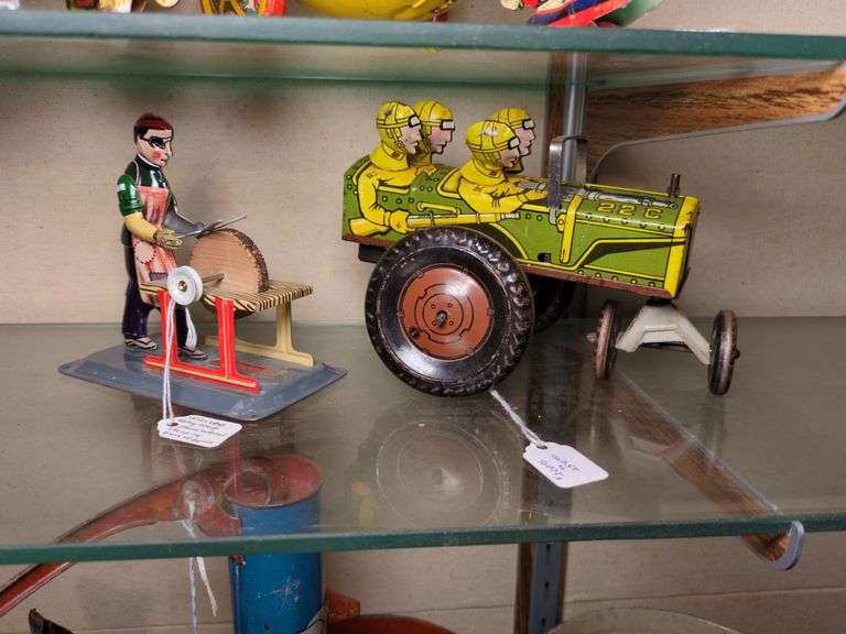 Wilesco Man using stone wheel and Marx tin litho Jumpin Jeep image