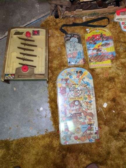 Marx Frenzy pinball toy, Marx Santa Fe pinball toy, Marx Johnny Apollo pinball toy and Wolverine Battle Action pinball toy image