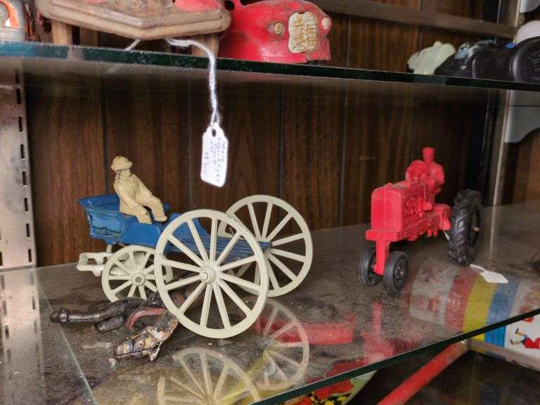 Auburn Rubber Company tractor with Operator and cast iron wagon with horses image