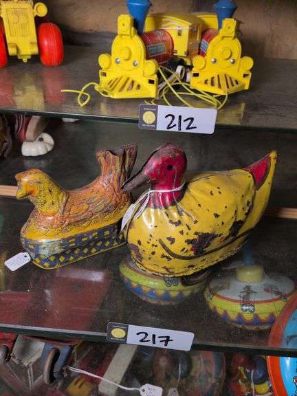 Baldwin chicken on nest and 1920's Dayton pressed steel duck friction toy image