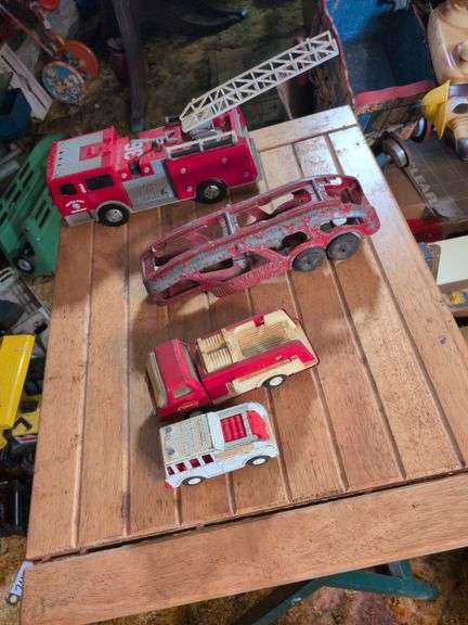 Metal tractor with trailer, Hubley truck and trailer and Fire trucks image