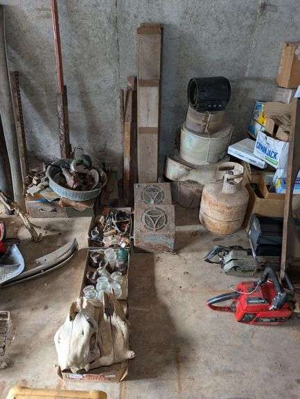 Antique Glass Insulators, Classic Car Parts, and Two Decorative Animal Skulls image