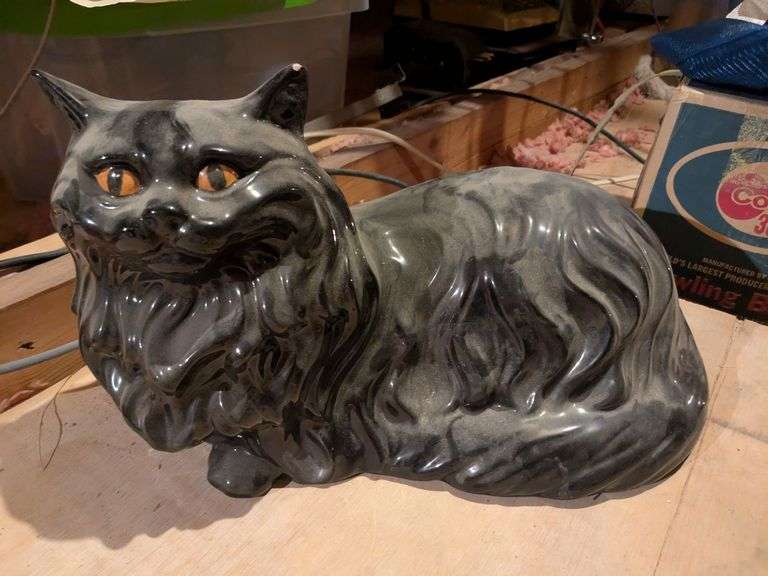 Metal sail boats and ceramic cat