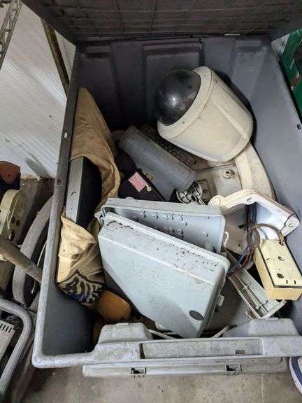 Three gray tubs with security system