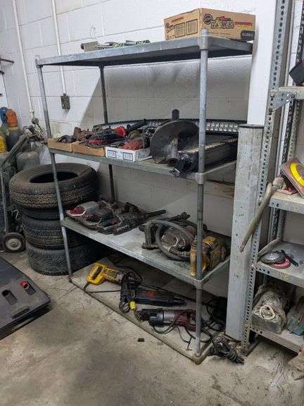 Shelf and contents of top shelf: caulking gun and misc.