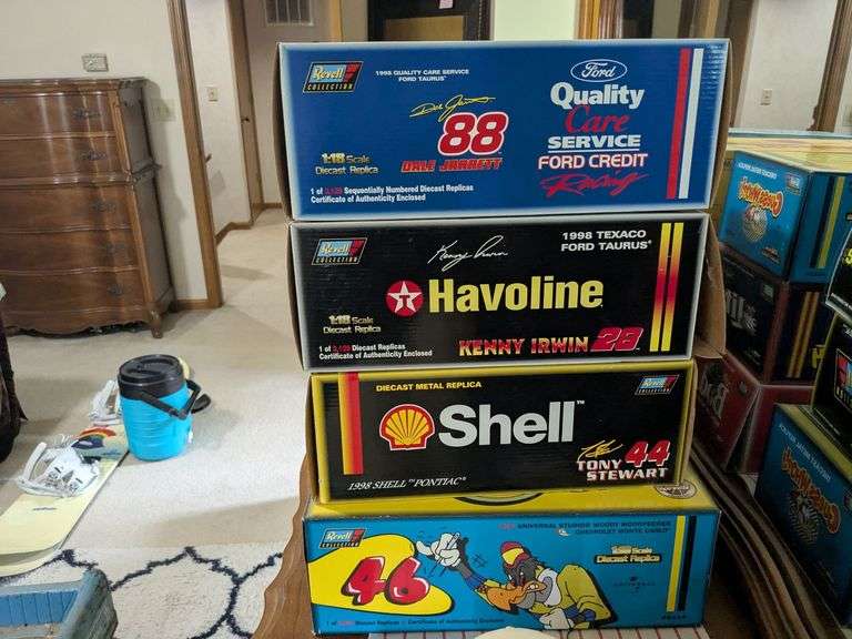 4 Revell 1:18 scale diecast replica cars: Dale Jarrett 88, Kenny Irwin 28, Tony Stewart 24 and 1997 Woody Woodpecker Chevy