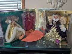 4 Barbie dolls