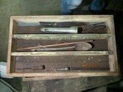 Vintage wooden chest with vintage tools
