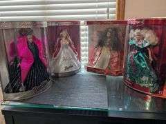4 Barbie dolls