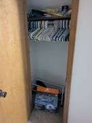 Items in closet: shoe rack, Ozark trail rapids rider III, hangers tennis balls and misc.