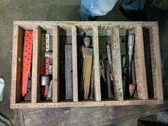 Vintage wooden chest with vintage tools
