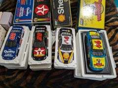 4 Revell 1:18 scale diecast replica cars: Dale Jarrett 88, Kenny Irwin 28, Tony Stewart 24 and 1997 Woody Woodpecker Chevy