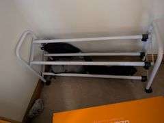 Items in closet: shoe rack, Ozark trail rapids rider III, hangers tennis balls and misc.