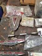 OEM and after market GTO emblems, parts, lights, brake pad, brake pad lining cover and misc.