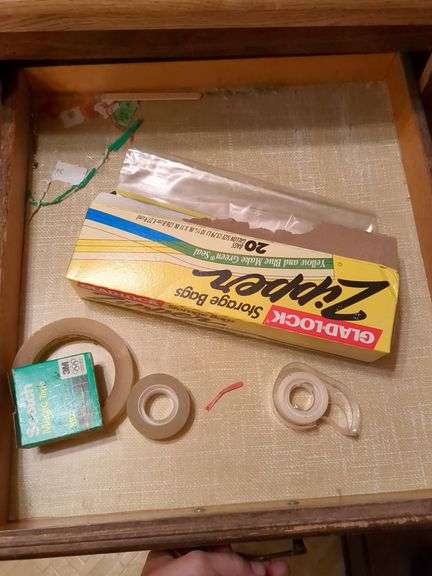 Top 3 drawers: silverware, kitchen gadgets, tape and misc.