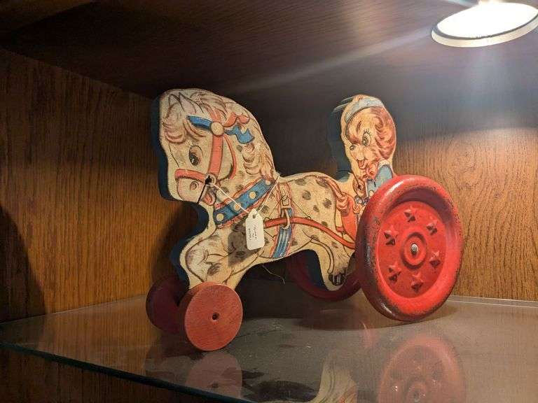 The Gongbell Mfg horse w/ dog and chariot pull toy image