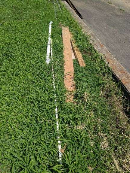 Metal pipes, plumbing pipes, scaffolding and sheets of wood image