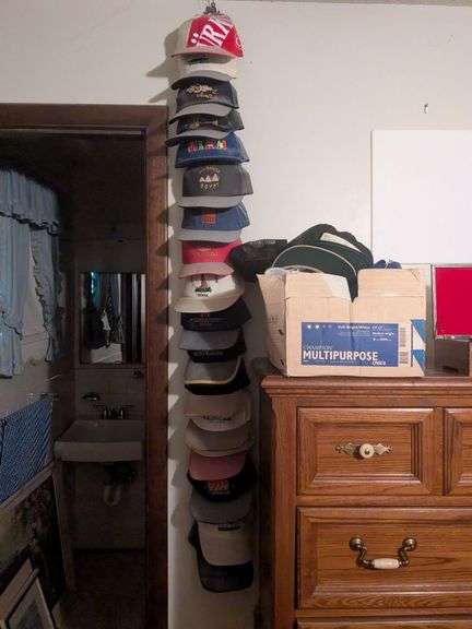 Box of hats including hats from overseas and hat stand image