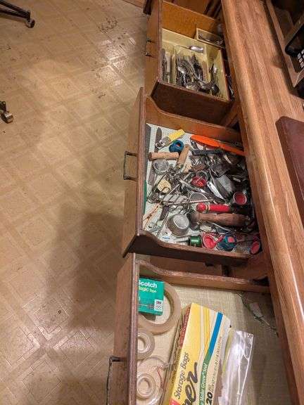 Top 3 drawers: silverware, kitchen gadgets, tape and misc. image