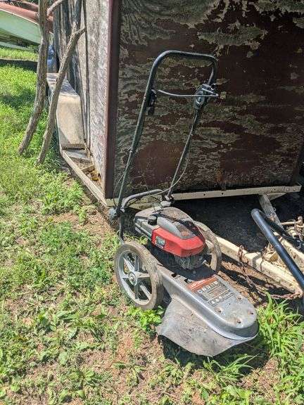 Craftsman 50 horsepower 22-in weed trimmer, Craftsman Cut-N-Catch mower, Sears Roto-Spader and Lawn Boy mower image