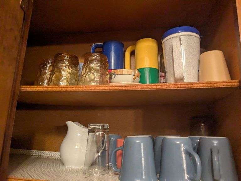 Top 2 shelves: travel cups, mugs, ceramic cup and platter, jug and misc. image
