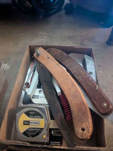 Folding saws, box cutter, tape measure, misc image