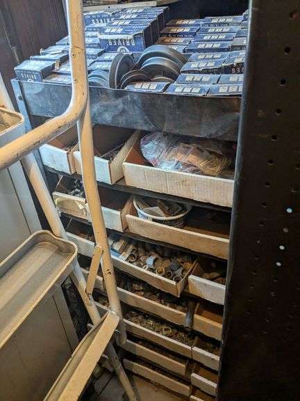 Rolling rack and contents: pulleys, lug nuts, washers and misc. image