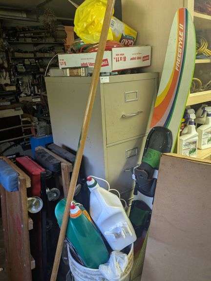 Filing cabinet and contents: weed eater lines, misc image