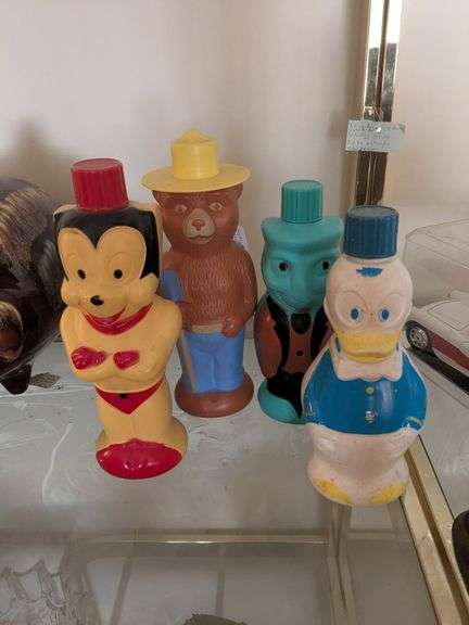 Set of 4 1960s Soaky Bubble Bath bottles: Donald Duck, Mighty Mouse, Smokey the Bear, and Jiminy Cricket image