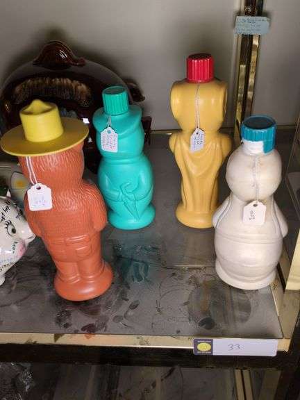 Set of 4 1960s Soaky Bubble Bath bottles: Donald Duck, Mighty Mouse, Smokey the Bear, and Jiminy Cricket