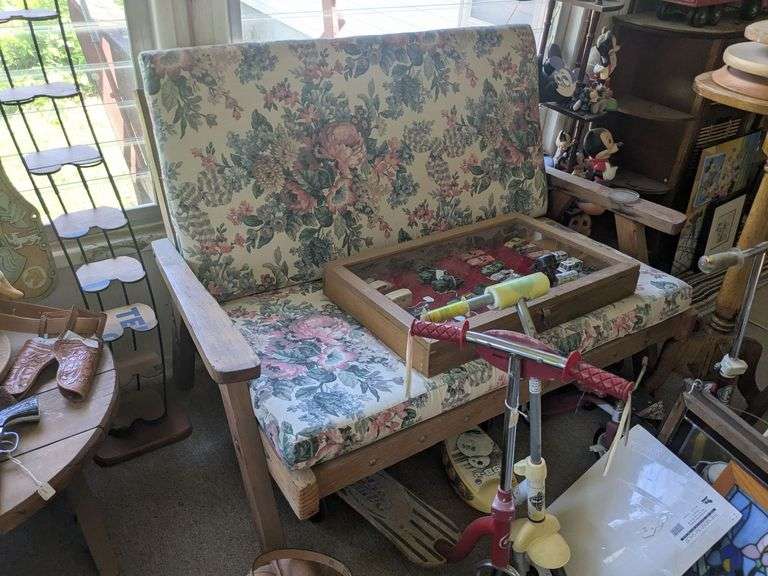 Wooden loveseat with cushions image