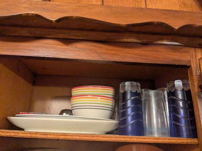 Top shelf: platters, bowls and blue wave glasses image