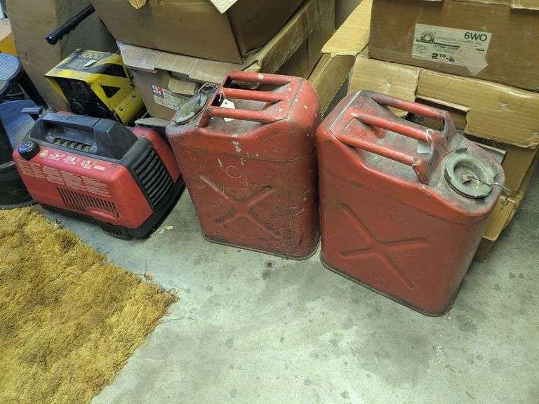 2 vintage gas cans, coleman powermate 1000 generator and battery booster image